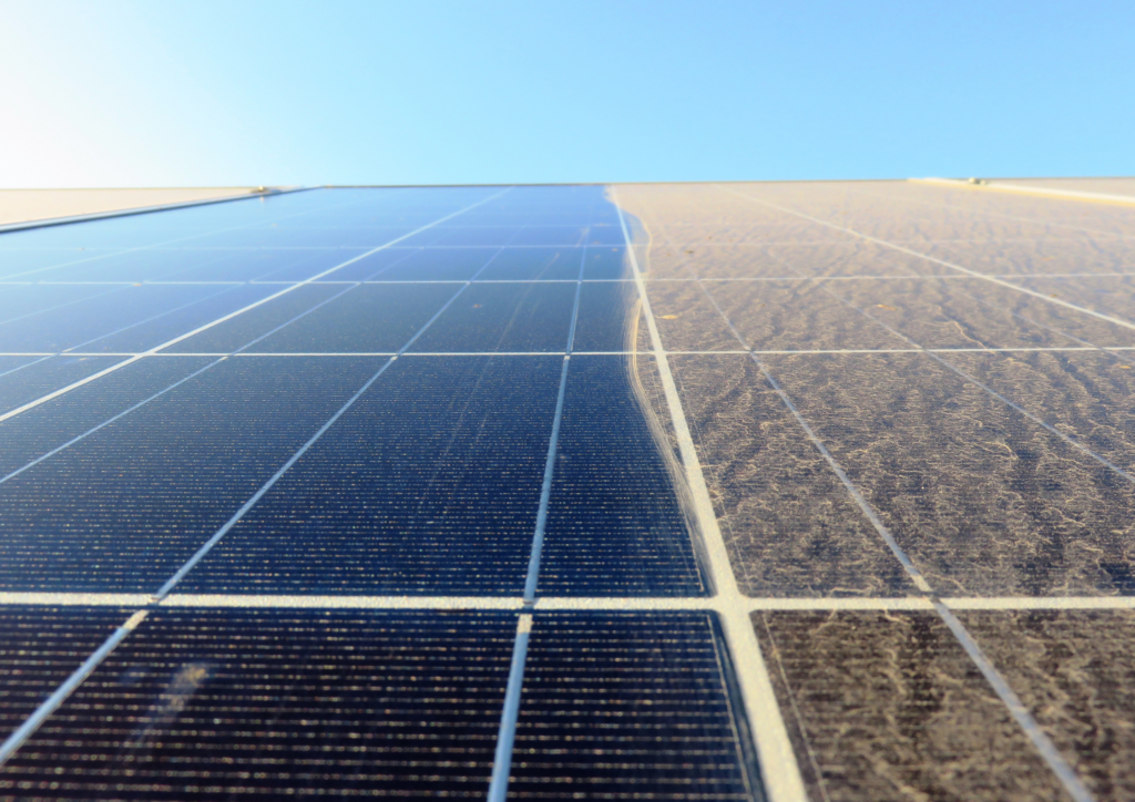 Solar panel, half of it is already been cleaned while the left side is dirty