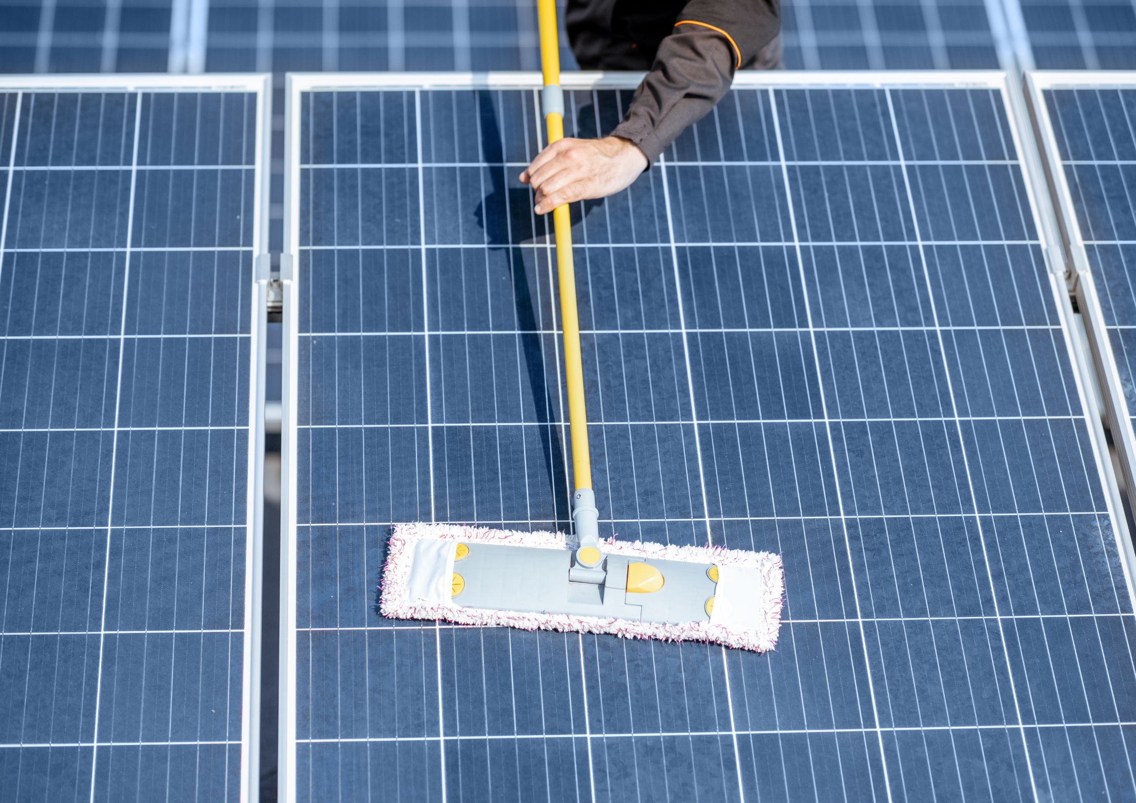 Mop is used to dry up solar panel