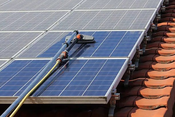 A water fed pole brush used to clean solar panel